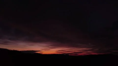 Fiery, peaceful sunset, slow movement to the left, drone shot. 스톡 동영상 140220633
