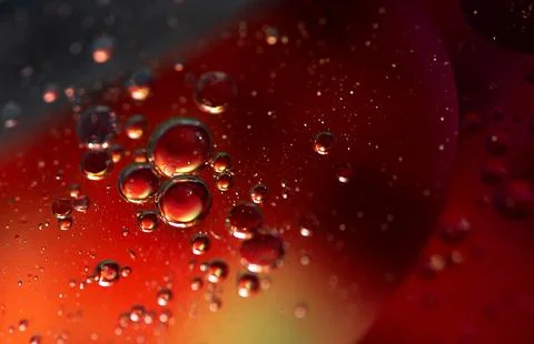 Fiery Red Oil Bubbles Creating Dramatic Liquid Abstraction Stock Photos