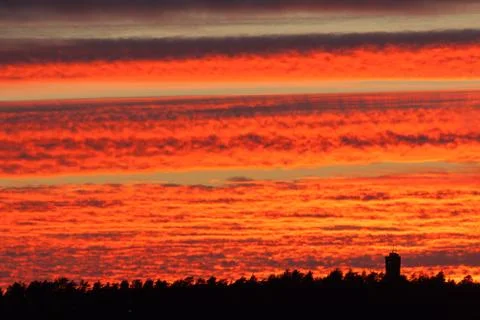 Fiery red sunset clouds Stock Photos