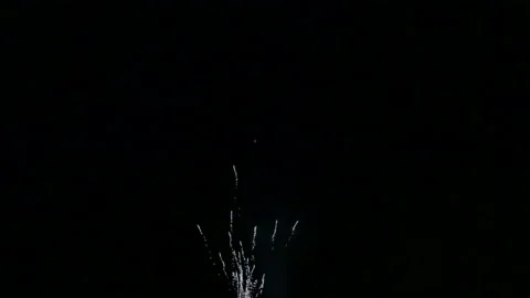 Fiery scattering of festive fireworks in the night sky above the river reflected 库存影片 113356333