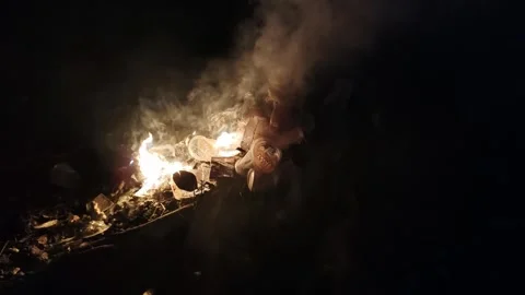 Fiery Scene with Burning Smoke and Plastic Waste in Dark Ambiance Stock Footage 308176652
