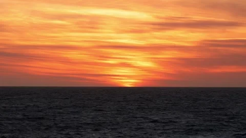 Fiery Sky Over the Dark Sea at Sunset. Sunset from Lindesnes Lighthouse Stock Footage 308811683