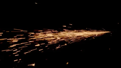 Fiery sparks fly from one point on a black background Stock Footage 129816895