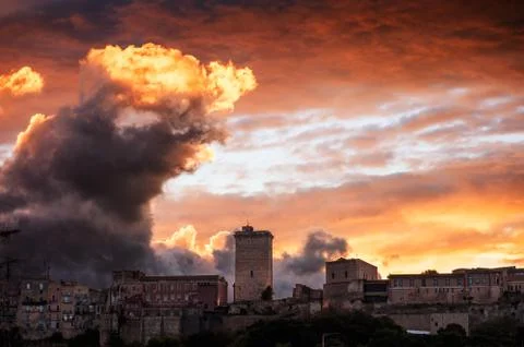 Fiery sunset on the ancient city Stock Photos
