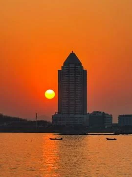 Fiery Sunset Behind Riverside Tower Stock Photos