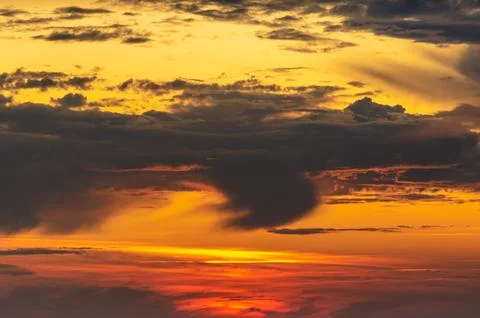 Fiery Sunset Clouds in Red and Orange Sky. Stock Photos