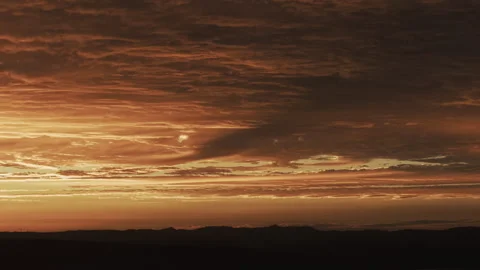 Fiery Sunset Cloudscape Majestic Dusk Sky Tracking Shot 4K HLG Stock Footage 344010916