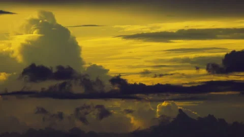 Fiery sunset with dark clouds lurking underneath Stock Footage 250010035