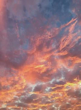 Fiery sunset with orange clouds Stock Photos