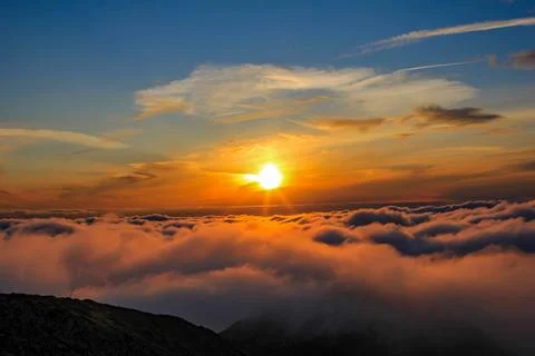Fiery Sunset Over Cloud-Covered Peaks - August 31, 2011 Stock Photos