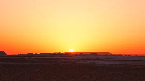 Fiery Sunset Over Desert Silhouetted Rocky Landscape Vídeos de archivo 341994831