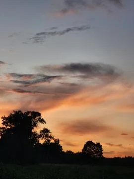 Fiery sunset over horizon panoramic view of evening sky texture Stock Photos