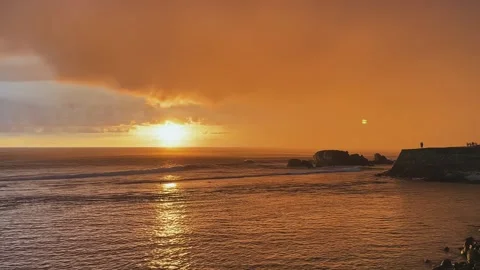 A fiery sunset on the seashore. storm clouds in the sea Stock Footage 276568690
