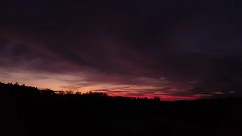 Fiery sunset, sideward right movement before Silhouette of trees, drone shot 스톡 동영상 140221015
