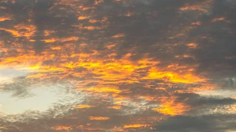 Fiery Sunset Sky with Clouds 스톡 사진