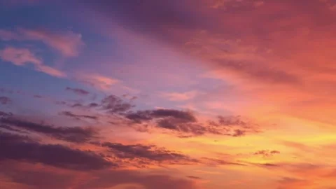 Fiery sunset sky with dramatic pink and orange clouds background Stock Footage 332874090