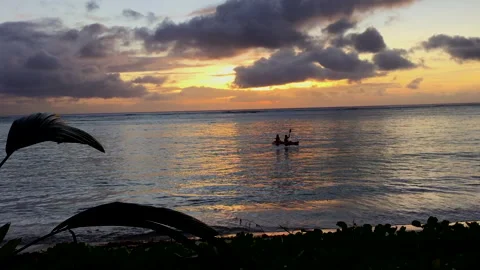 Fiery sunset streaks A gorgeous sunset in Saipan, Northern Mariana Islands 库存影片 136547340