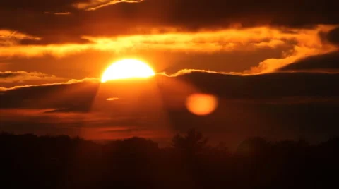 Fiery sunset with sun into clouds. Timelapse. Stock Footage 42201871