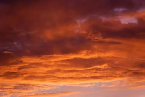 Fiery sunset. Sunset clouds. Beautiful sky at sunset. Stock Photos