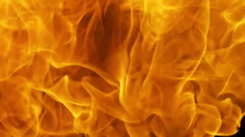 Fiery Swirls of Vivid Yellow Flame Dance in the Shadows Capturing Intense M.. Vídeo Stock 341920391