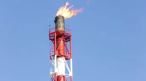 Fiery torch from the gas pipe on the background of blue sky Stock-Footage 56593177