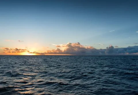 Fiery tropical ocean sunset Stock Photos