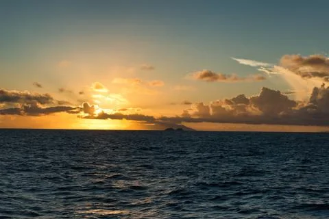 Fiery tropical ocean sunset Stock Photos