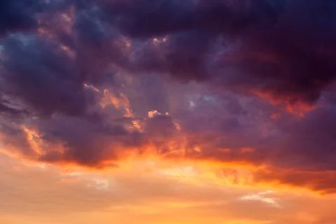 Fiery vivid sunset sky clouds Stock Photos