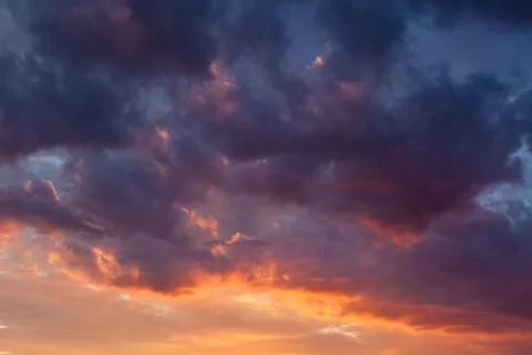Fiery vivid sunset sky clouds Stock Photos