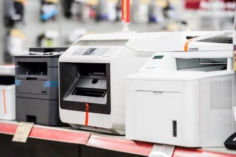 Fiew laser printers in electronic computer store Stock Photos