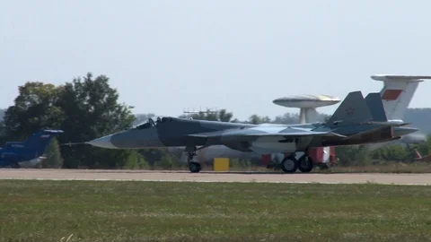 Fifth generation multi-purpose aircraft Su-57 is taxiing on runway. Stock Footage 107173942