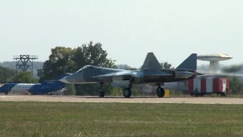 Fifth-generation multipurpose aircraft Su-57 taxis along runway and stops. Stock Footage 107173983