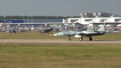 Fifth-generation Russian Su-57 multirole fighter moves along runway. Stock Footage 120682390