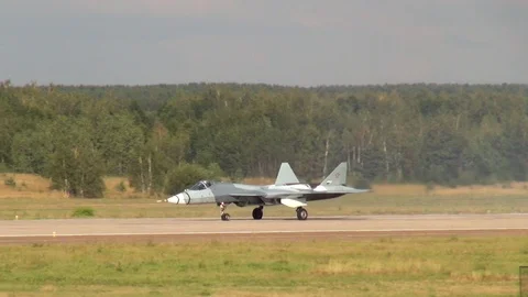 Fifth-generation Russian Su-57 multirole fighter moves along runway. Stock Footage 120804240
