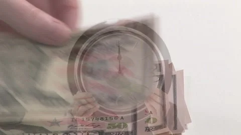 Fifty-dollar bill stack entering from lower-left, hands fanning and shifting Stock Footage 328584202