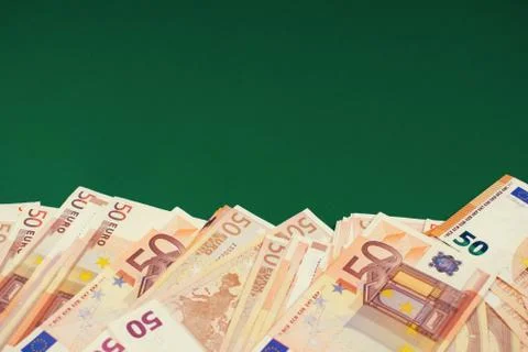 Fifty euro notes on green background. Foto stock