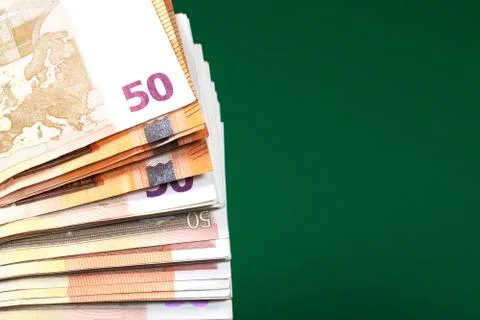 Fifty euro notes on green background. Stock Photos