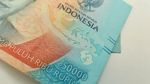 Fifty thousand Indonesian rupiah banknotes on a white background Video stock 311494053