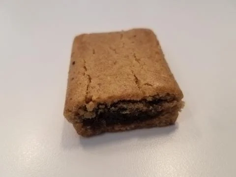 A fig cookie on a white surface Stock Photos