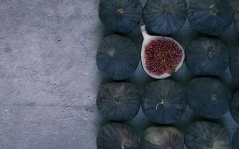 Fig cut in half with figs in row. Stock Photos