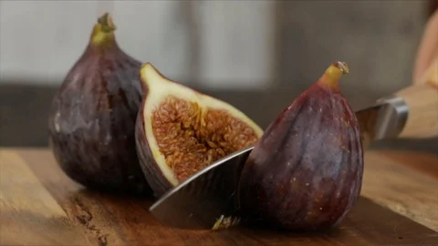 Fig is Cut into Halves Closeup Slow-motion Stock Footage 99138947