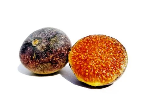 FIG FRUIT WITH HALF SLICE OF FIG WITH WHITE BACKGROUND Stock Photos