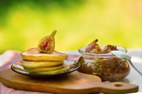 Fig jam and pancakes on table, summer Stock Photos