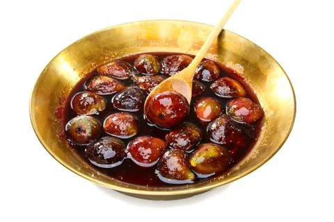 Fig jam in the copper basin. Stock Photos