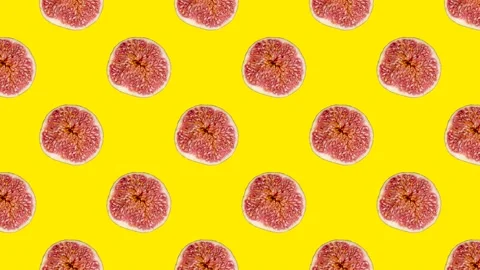 Fig slices in animated grid seamless loop pattern on a yellow background. Abstra Stock Footage 222318635