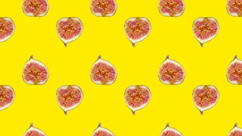Fig slices in animated grid seamless loop pattern on a yellow background Stock Footage 222321721