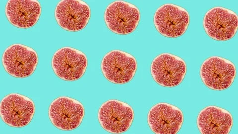 Fig slices in animated grid seamless loop pattern on a light blue background Stock Footage 222326543