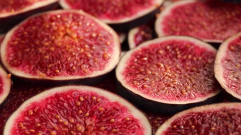 Fig slices, rotation in circle. close-up of fresh juicy figs Turning Stock Footage 252797488