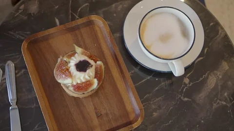 Fig Tart and Coffee on a Marble Table Stock Footage 345774432