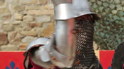 A fight between two knights in armor day Stock Footage 53288029